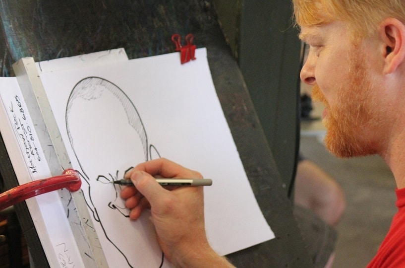 A man painting a caricature