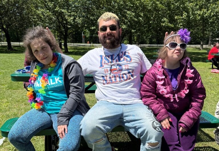 Direct Support Professional Constantine Vasiliou with two people he supports