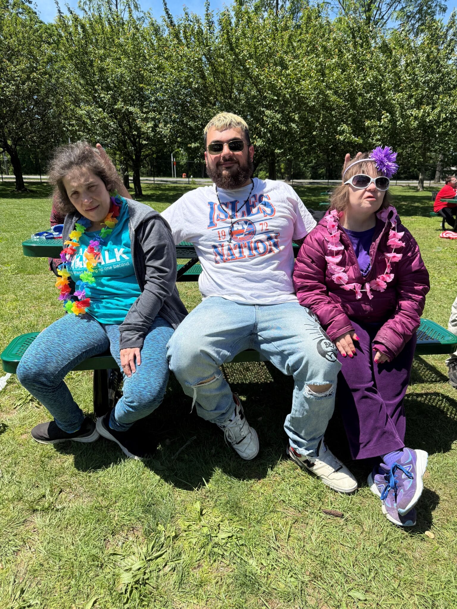 Direct Support Professional Constantine Vasiliou with two people he supports