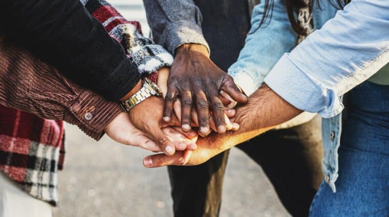 A group of hands meeting together in a circle