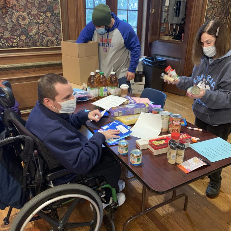 Volunteer table prepares boxes