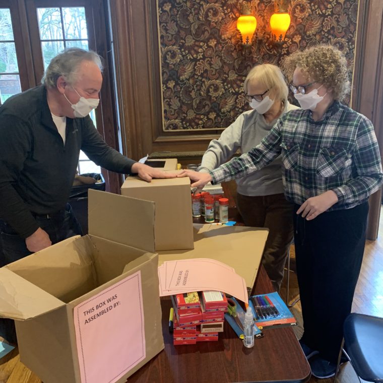 Volunteer family prepares boxes