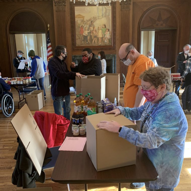 Volunteer team prepares boxes