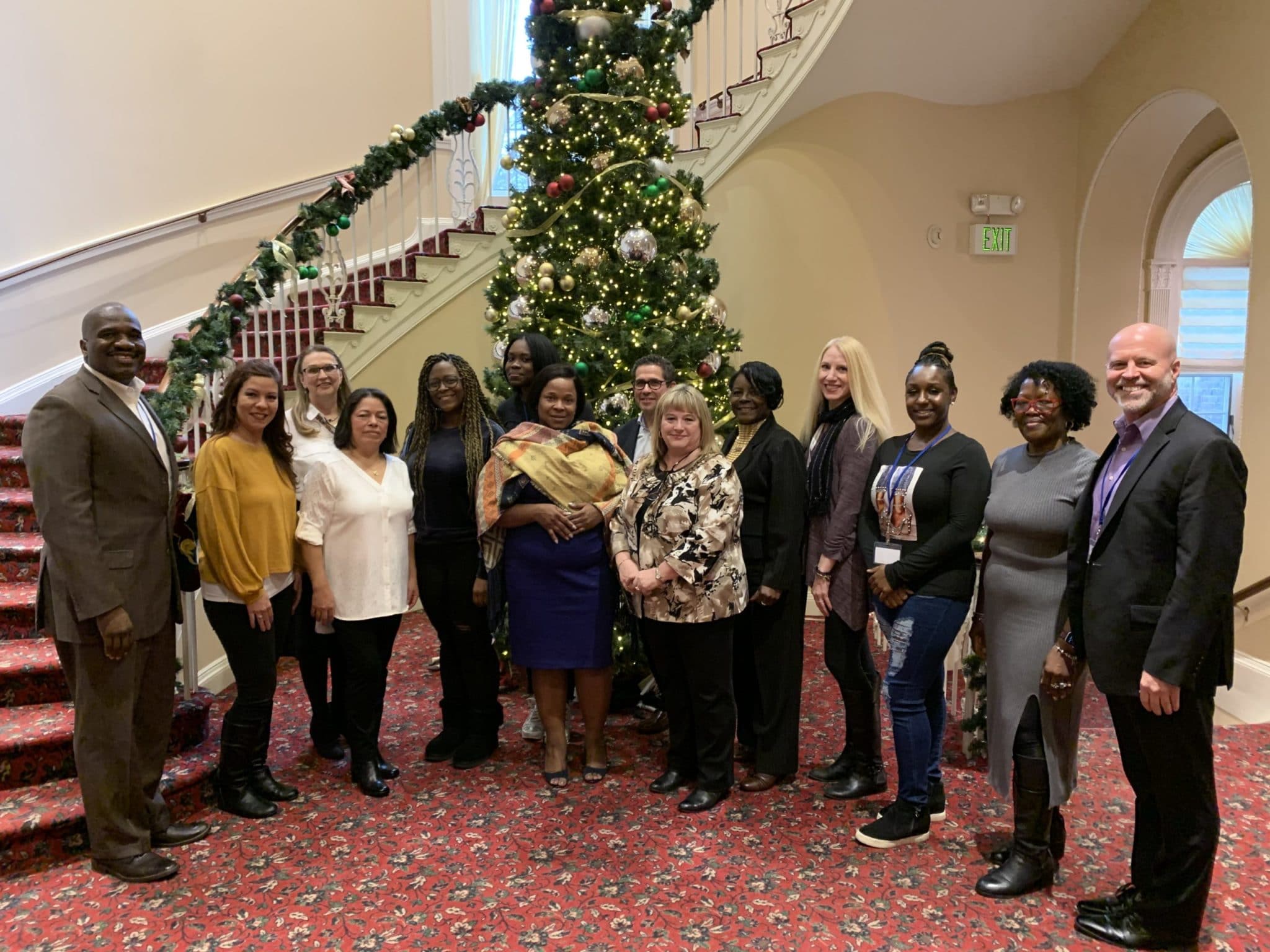 AHRC, Citizens and BCCS Employees take a photo at the Employee of the Quarter Luncheon with Executive Director, Stanfort Perry, and Associate Executive Director, Chris O'Connor