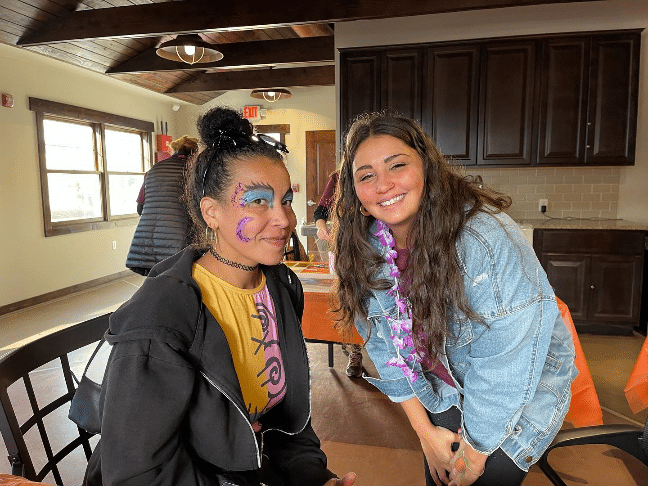 Attendees show off their painted faces at the Wheatley Farms Fall Festival