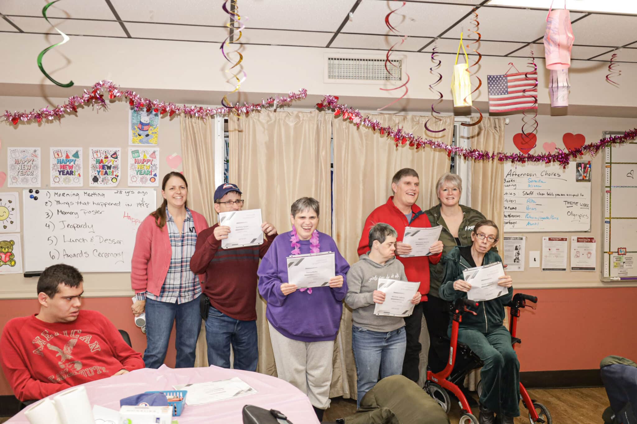 Farmingdale 1 residents hold up their certificates.