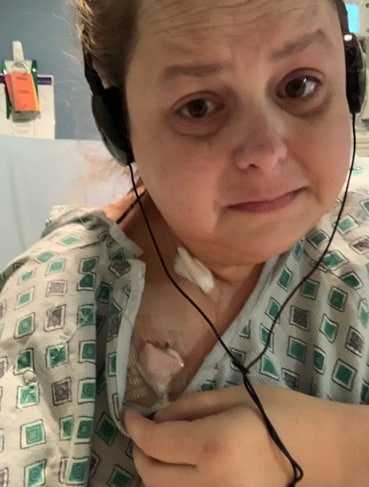 Krystie in the hospital with a catheter on her chest.