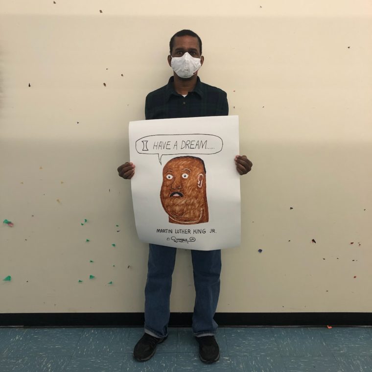 Artist shows his painting of MLK