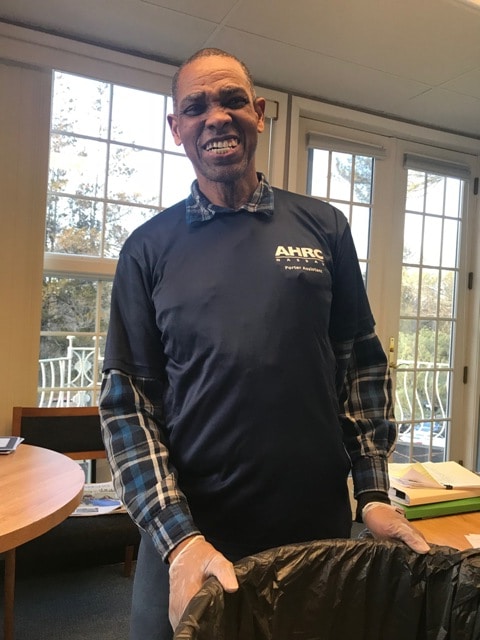 A person supported working in trash removal