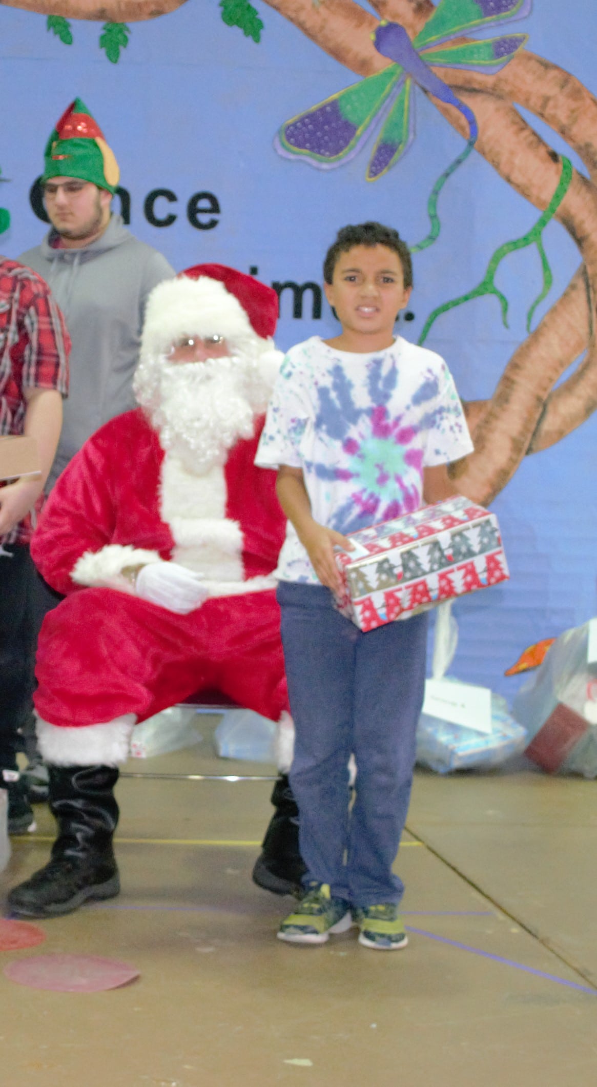 Young boy receives present from Santa