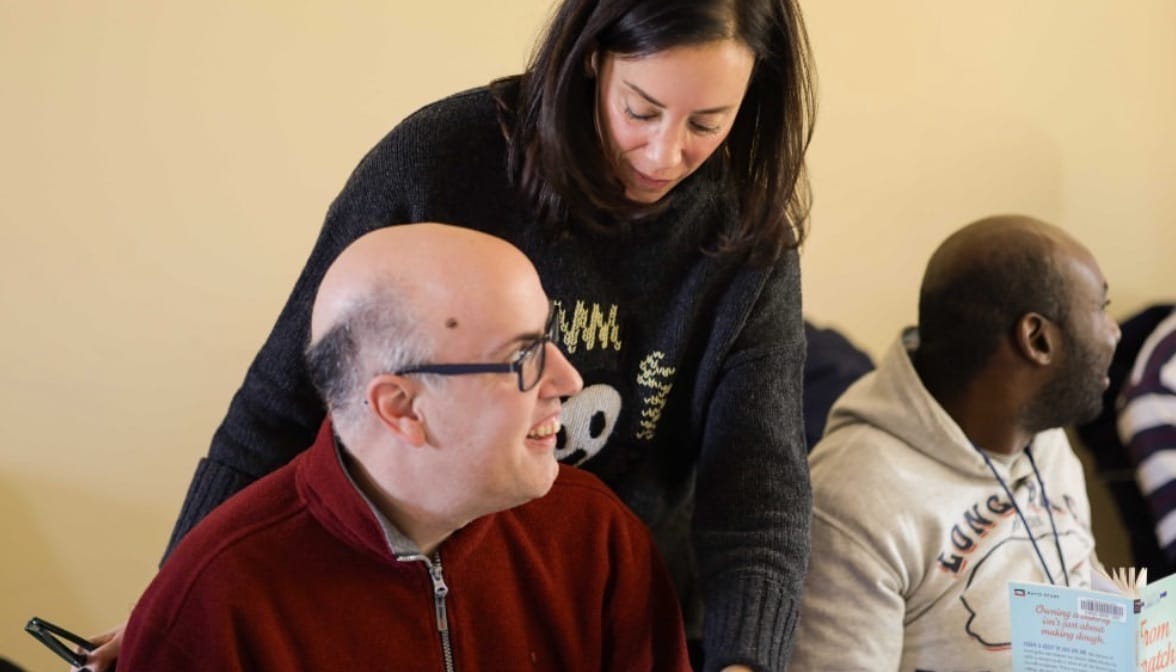 Volunteer Robyn Semilof with a book club attendee