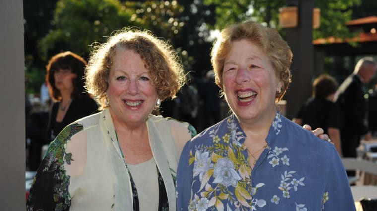 Sisters Roz and Shelley Goldmacher smile at an AHRC Nassau event.