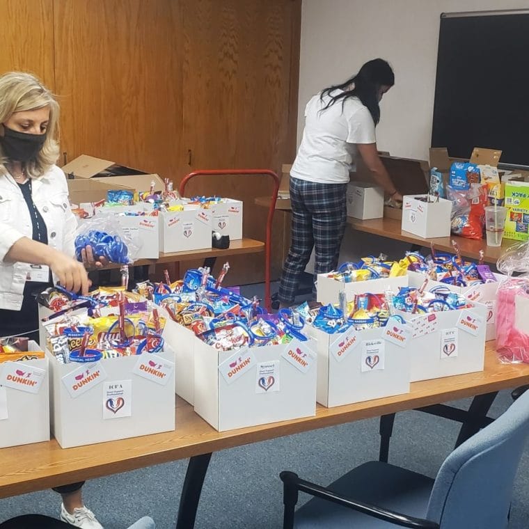 Day Hab administrators prepare sunshine bags for staff