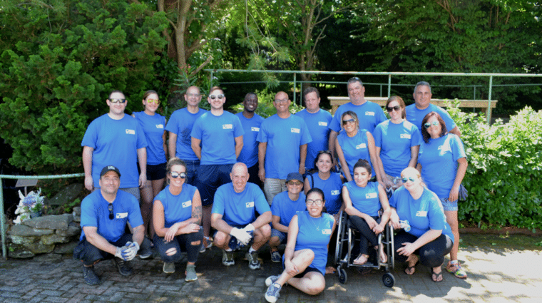 Associated Pension Consultants volunteering at the historic AHRC Nassau Greenhouse in Brookville