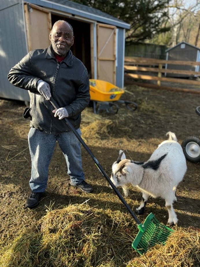 Person supported works with animal at Wheatley Farms