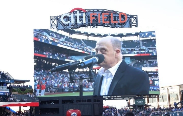 Adam Levine on the screen at Citi Field singing the National Anthem.