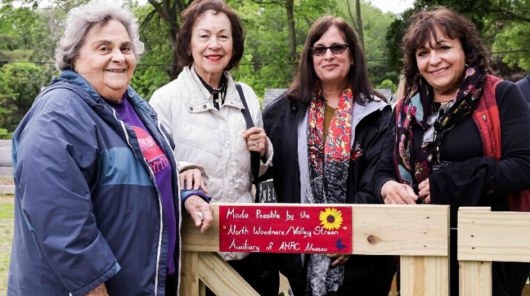 Four members of North Woodmere/Valley Stream Auxiliary in the garden that their donation helped build.