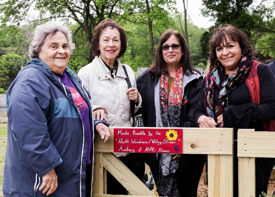 Four members of North Woodmere/Valley Stream Auxiliary in the garden that their donation helped build.