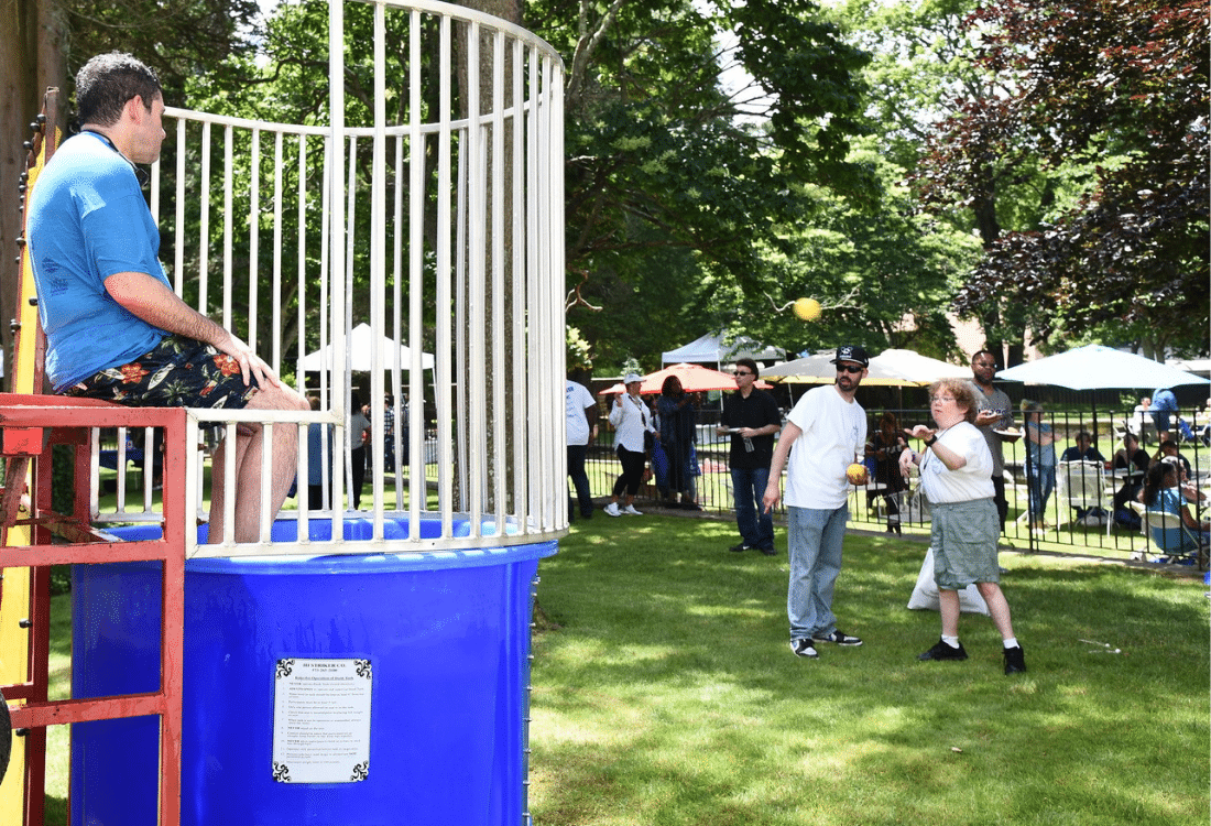 AHRC Staff Appreciation Day guest throws ball at the dunk tank target