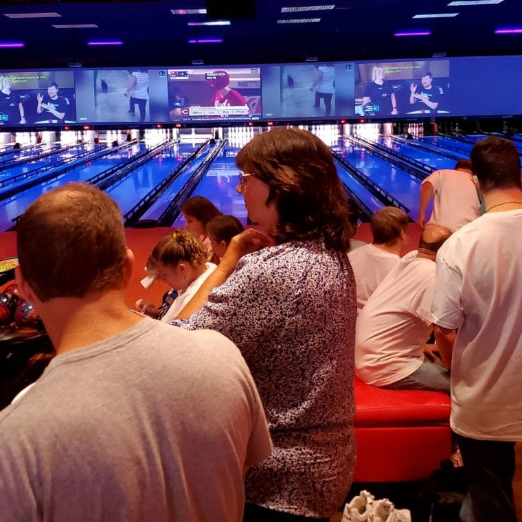 Event attendees cheer on bowlers