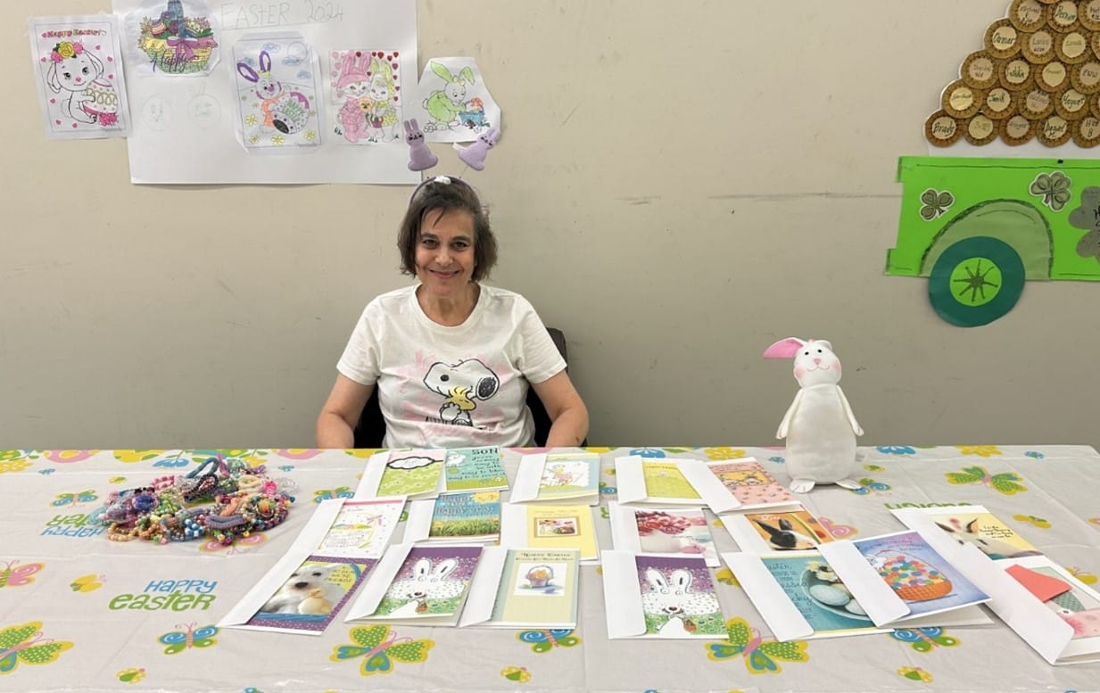 Christine Marra poses with some cards that she designed for Easter