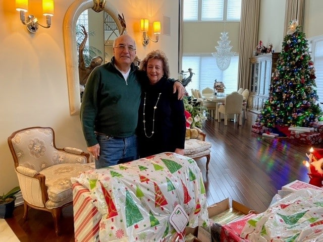 People posing with Christmas Gifts