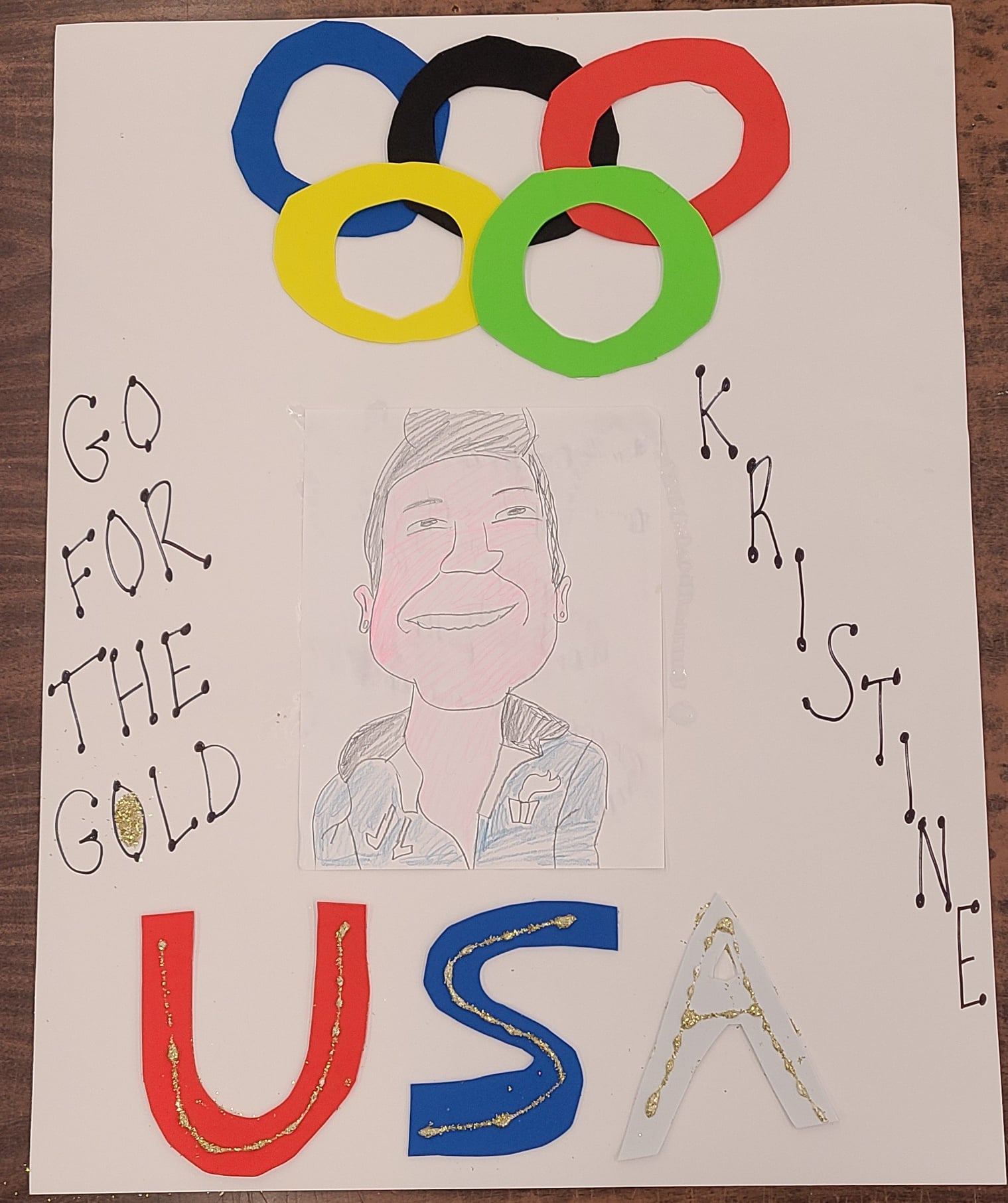 Sign that says "Go for the gold! USA - Kristine!"