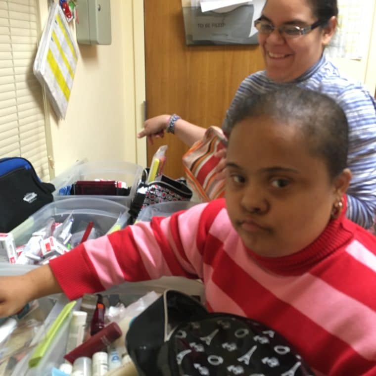 AHRC Day Hab volunteers put together baskets for MOMMAS House.