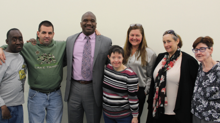 NYSID President and CEO Maureen O'Brien (third from right) and NYSID Vice President Meredith Hartman (second from right) visit with AHRC Nassau Executive Director Stanfort Perry (center) along with (from left) Vladimir Noel, Derek Carney, Jean Marie Rogers and Geraldine Gardner.