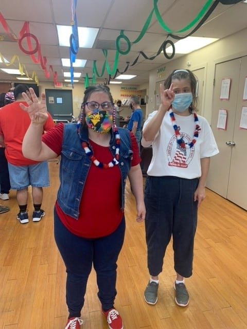 More smiles and cheers from people supported at the Bethpage Hubsite during Olympics Day