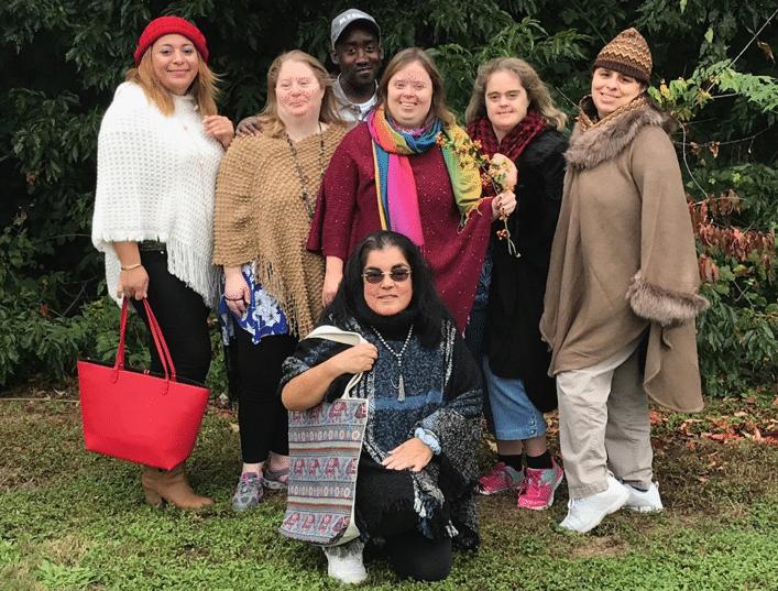 AHRC models show off our colorful merchandise, including hats, scarves & bags.