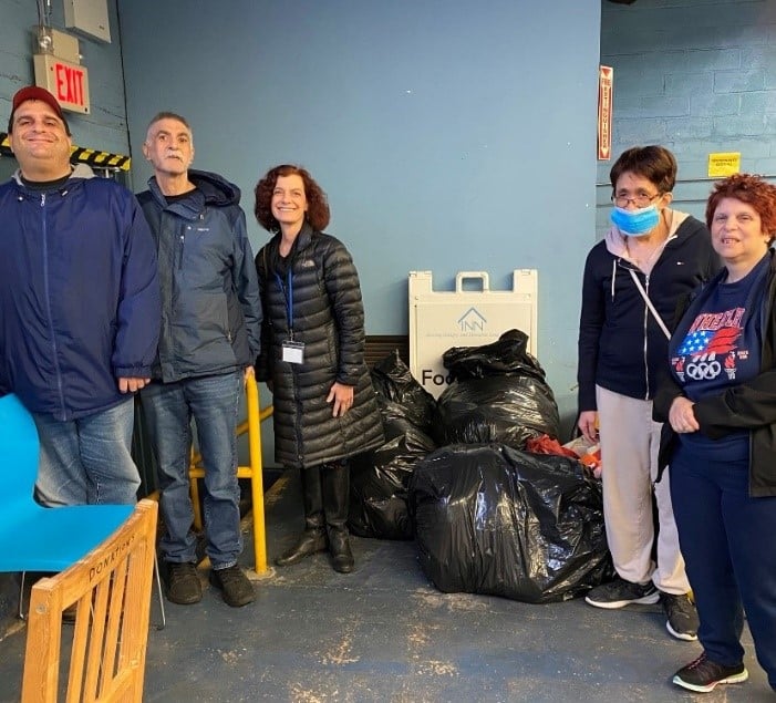 Members of the Pre-Voc Workforce Council and the coats they have collected 