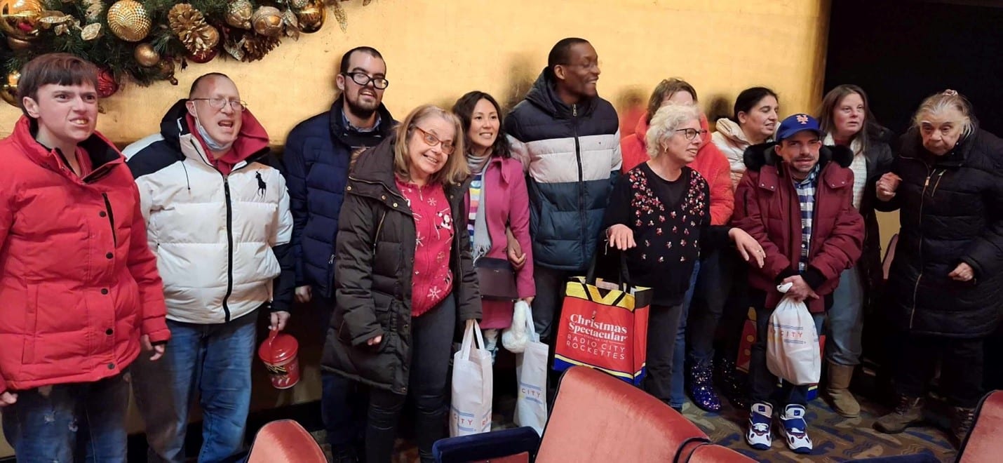 AHRC Residents pose for a photo after seeing the Radio City Rockettes