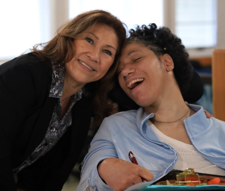 AHRC staff member poses with Regina Clark