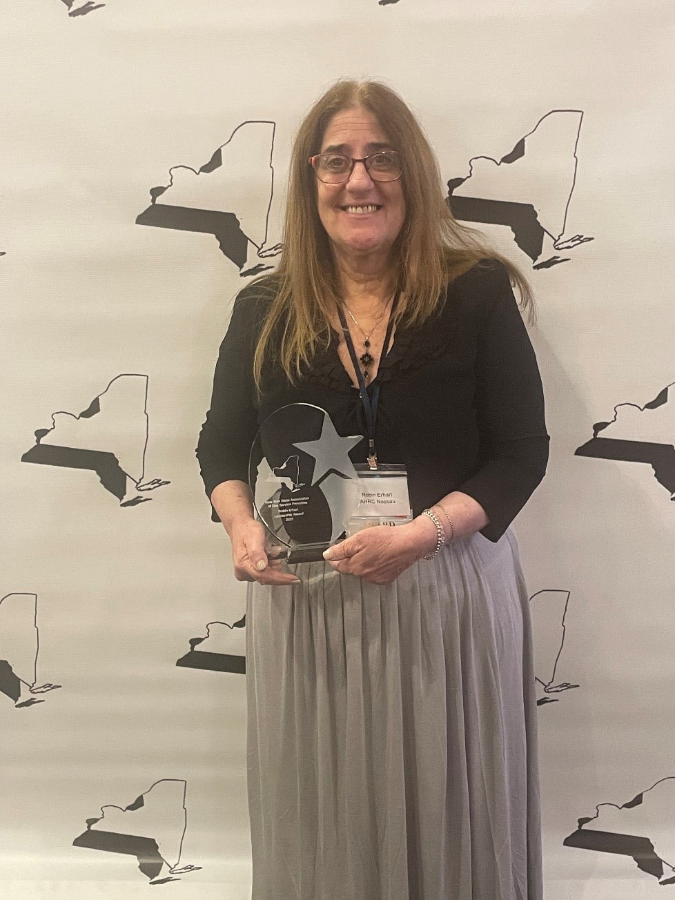 Robin Erhart poses with her award