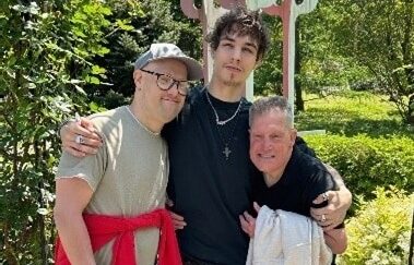 Direct Support Professional Ephraim “Roky” Dabney with two people he supports