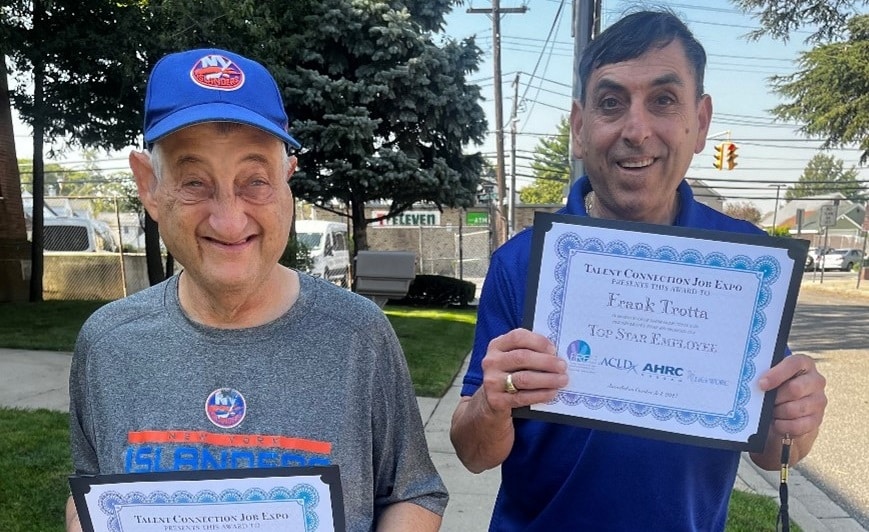 Ronald Berglass and Frank Trotta pose with their awards
