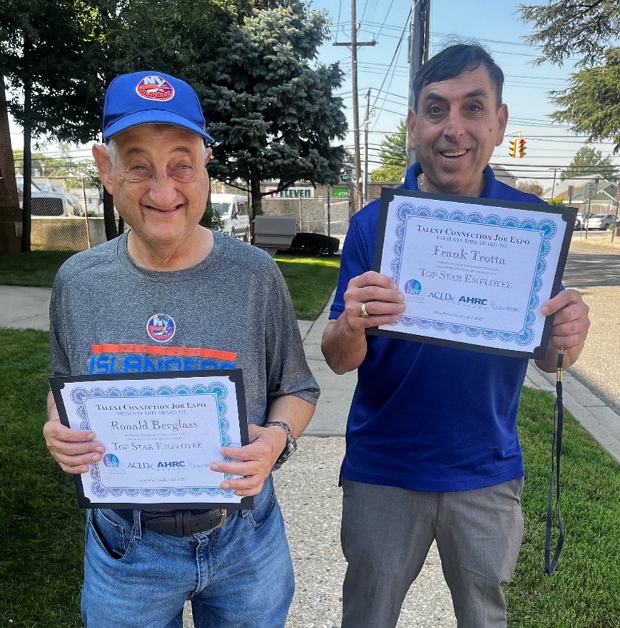 Ronald Berglass and Frank Trotta pose with their awards