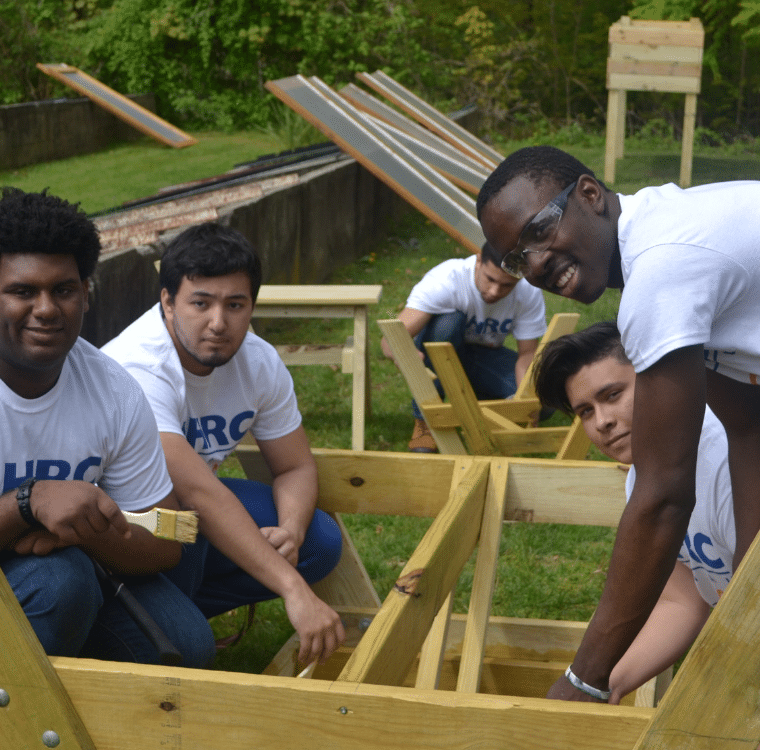 AHRC Nassau and BOCES - Barry Tech add finish to a picnic table.