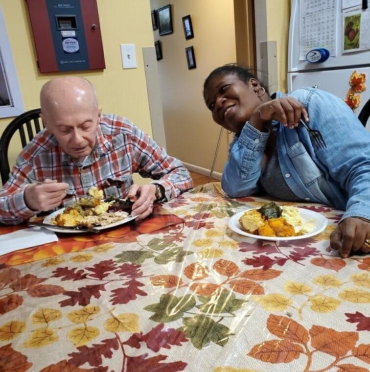 Person supported by AHRC enjoys Thanksgiving dinner