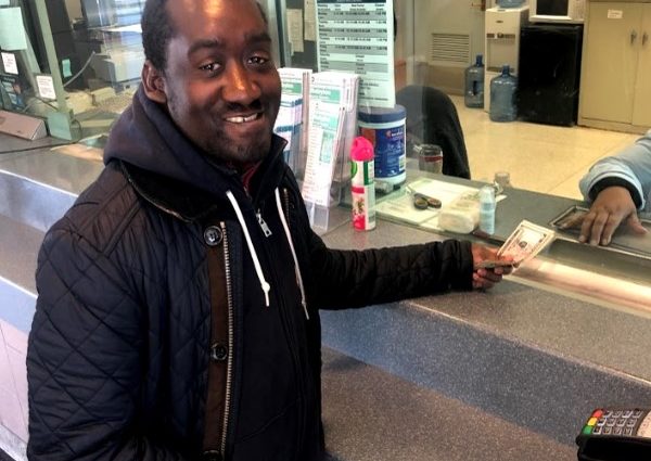 Vladimir Noel pays for Long Island Railroad tickets.