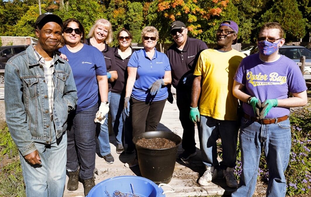 Volunteers from Webster Bank and people supported by our day program at Wheatley Farms