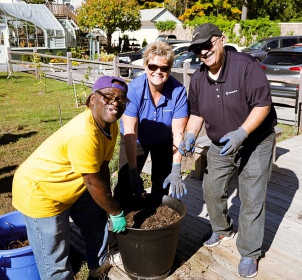 Volunteers from Webster Bank and people supported by our day program at Wheatley Farms