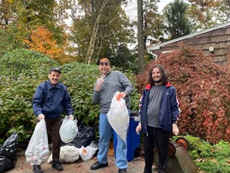 People supported pose with the items they collected for the animal welfare nonprofit